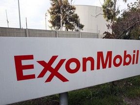 FILE - This Jan. 30, 2012, file photo, shows a sign at an Exxon Mobil refinery in California. Exxon Mobil is settling air pollution cases with the Trump administration by paying a $2.5 million civil penalty and promising to spend $300 million on pollution-control technology at several plants along the Gulf Coast. Federal officials said Tuesday, Oct. 31, 2017, that the settlement will prevent thousands of tons of future pollution, including cancer-causing benzene, from eight petrochemical plants in Texas and Louisiana. (AP Photo/Reed Saxon, File)