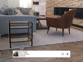 FILE - This May 2016 photo provided by Wayfair demonstrates the company's augmented reality app, WayfairView, which allows shoppers to visualize furniture and decor in their homes at full-scale before they make a purchase. This image shows a screen grab taken with the app of an end table that has been selected to visualize in the space. (Wayfair via AP, File)