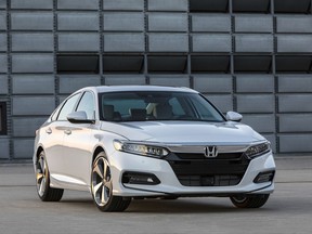 This photo provided by Honda shows the 2018 Honda Accord, a top-selling midsize sedan. It's all-new from the ground up for 2018. It has more interior space and cargo room, fresh and dramatic styling, and a comfortable cabin. (Wes Allison/Courtesy of American Honda Motor Co. Inc. via AP)