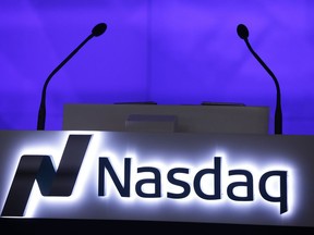 This Monday, Nov. 30, 2015, photo, shows the Nasdaq logo displayed in the electronic stock trading company's Times Square location in New York. U.S. stock indexes peeked higher in morning trading on Thursday, Oct. 5, 2017, and if the Standard & Poor's 500 maintains its slight gain, it would mark the longest winning streak for the index in four years. Trading was again mostly quiet around the world, and markets were closed at several of Asia's big exchanges due to holidays. (AP Photo/Mark Lennihan)