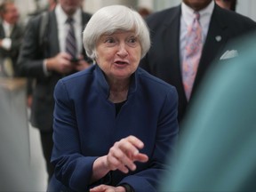 FILE - In this Tuesday, Sept. 26, 2017, file photo, Federal Reserve Chair Janet Yellen speaks to a student at a job training center in Cleveland. On Friday, Oct. 20, Yellen is scheduled to speak at the British Embassy in Washington on the subject of monetary policy since the financial crisis. (AP Photo/Dake Kang, File)