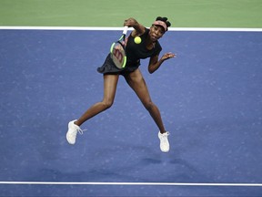 FILE - In this Sept. 7, 2017 photo, Venus Williams, of the United States, returns a shot from compatriot Sloane Stephens during the semifinals of the U.S. Open tennis tournament, in New York. Williams returns to the year-end WTA Finals for the first time since reaching the 2009 final, and the fifth time overall, starting on Sunday, Oct. 22 in Singapore. (AP Photo/Andres Kudacki, File)