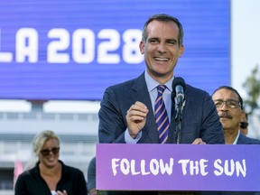 FILE - In this July 31, 2017 file photo, Los Angeles Mayor Eric Garcetti speaks during a press conference to make an announcement for the city to host the Olympic Games and Paralympic Games 2028, at Stubhub Center in Carson, outside of Los Angeles, Calif. Garcetti is taking his argument on the road, but he doesn't want you to assume he steering himself toward the White House. The mayor of the nation's second largest city has been traveling nationally to raise money and campaign for other Democrats. He's making the rounds Saturday, Oct. 21 at the Democratic Party's annual meeting in Las Vegas.  (AP Photo/Ringo H.W. Chiu, File)