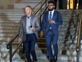 Dallas Cowboys star Ezekiel Elliott, right, exits federal court after a hearing Monday, Oct. 30, 2017 in New York. Elliott is seeking to have his six game suspension by the NFL postponed. (AP Photo/Craig Ruttle)