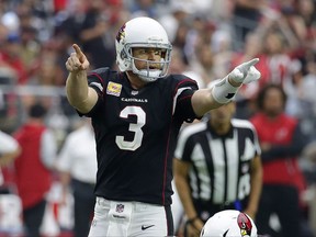 FILE - In this Oct. 15, 2017, file photo, Arizona Cardinals quarterback Carson Palmer (3) signals to receivers during the second half of an NFL football game against the Tampa Bay Buccaneers, in Glendale, Ariz. As Arizona limps into its bye week at 3-4, the Cardinals have just lost quarterback Carson Palmer with a broken arm. (AP Photo/Rick Scuteri, File)