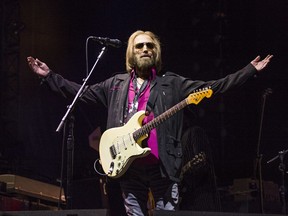 FILE - In this Sept. 17, 2017 file photo, Tom Petty of Tom Petty and the Heartbreakers appears at KAABOO 2017 in San Diego, Calif. A spokesman for the Los Angeles Police Department says it has no information on the well-being of Tom Petty and its spokespeople did not provide info CBS News used to report the rocker had died. News outlets reported Monday, Oct. 2, that Petty was dead at age 66. CBS did not cite a source in its story, but tweeted that LAPD confirmed Petty's death. CBS now says he is "clinging to life." (Photo by Amy Harris/Invision/AP, File)