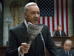 This image released by Netflix shows Kevin Spacey in a scene from "House Of Cards." Netflix says it's suspending production on "House of Cards" following harassment allegations against Spacey.  (David Giesbrecht/Netflix via AP)