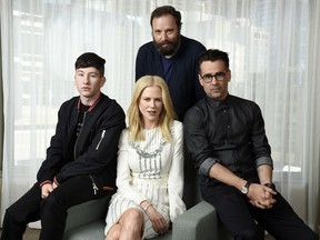 In this Sept. 9, 2017 photo, writer-director Yorgos Lanthimos, background center, and cast members of "The Killing of a Sacred Deer," from left, Barry Keoghan, Nicole Kidman and Colin Farrell pose for a portrait during the Toronto International Film Festival in Toronto. (Photo by Chris Pizzello/Invision/AP)