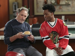This image released by CBS shows Judd Hirsch, left, and Jermaine Fowler in a scene from the new comedy series, "Superior Donuts," beginning its second season on Monday. (Michael Yarish/CBS via AP)