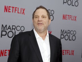 FILE - In this Dec. 2, 2014, Harvey Weinstein attends the season premiere of the Netflix series "Marco Polo" in New York. Weinstein faces multiple allegations of sexual abuse and harassment from some of the biggest names in Hollywood. (Photo by Andy Kropa/Invision/AP, File)