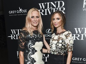 FILE - In this Aug. 2, 2017 file photo, fashion designers Keren Craig, left, and Georgina Chapman, co-founders of Marchesa, attend a special screening of "Wind River", in New York. Chapman took what some believed was her only brand-saving leap Tuesday, Oct. 10, 2017, as sex abuse allegations against her husband Harvey Weinstein mounted. Breaking her six-day silence when she told People she was leaving the film mogul she married in 2007. The divorce revelation came as some on social media called for a Marchesa boycott. (Photo by Evan Agostini/Invision/AP, File)