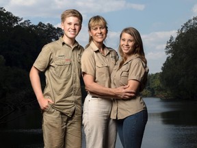 This image released by Animal Planet shows the Irwin family, from left, Robert, Terri and Bindi. The Irwin family is returning to television's Animal Planet, 11 years after the death of "The Crocodile Hunter" star and family patriarch Steve Irwin. The network announced Wednesday that they will work with Animal Planet on television and digital projects that will begin being seen next year. (