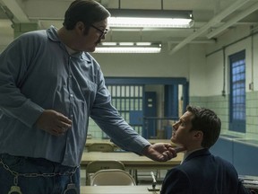 This image released by Netflix shows Cameron Britton, left, and Jonathan Groff in a scene from the 10-episode series, "Mindhunter," streaming on Netflix starting Friday. (Merrick Morton/Netflix via AP)