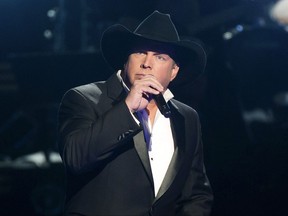 FILE - In this Nov. 2, 2016 file photo, Garth Brooks performs at the 50th annual CMA Awards in Nashville, Tenn. Brooks, along with Brothers Osborne, Luke Bryan, Eric Church, Alan Jackson, Miranda Lambert, Little Big Town, Old Dominion, Jon Pardi, Chris Stapleton, Thomas Rhett and Carrie Underwood will all perform at this years Country Music Association awards on Nov. 8. (Photo by Charles Sykes/Invision/AP, File)