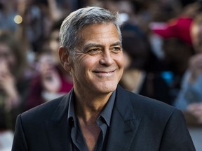 FILE - In this Sept. 9, 2017 file photo, director and actor George Clooney arrives at a screening for "Suburbicon" during the Toronto International Film Festival in Toronto. Clooney will be the 46th recipient of the AFI Life Achievement Award. The American Film Institute announced Thursday that they will honor the actor-director at a gala tribute in June. (Nathan Denette/The Canadian Press via AP, File)