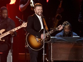 FILe - In this Nov. 4, 2015 file photo Justin Timberlake performs at the 49th annual CMA Awards in Nashville, Tenn. Timberlake will headline the Super Bowl halftime show Feb. 4 in Minnesota. (Photo by Chris Pizzello/Invision/AP)