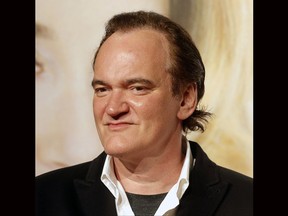 FILE - In this Oct. 8, 2016 file photo, director Quentin Tarantino poses for photographers at the opening ceremony of the 8th Lumiere Festival, in Lyon, central France. Tarantino says he knew about a few instances of improper conduct by producer Harvey Weinstein and wishes he had done more. Speaking to The New York Times in an interview published Thursday, Oct. 19, 2017, Tarantino expressed remorse for not having taken responsibility at the time. He says he knew first hand of Weinstein's conduct toward actress Mira Sorvino and another he declined to name. Sorvino and Tarantino were dating at the time. (AP Photo/Laurent Cipriani, File)