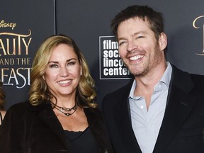 FILE - In this March 13, 2017 file photo, singer Harry Connick Jr. poses with his wife Jill Goodacre at a special screening of Disney's "Beauty and the Beast" in New York. When it comes to Halloween, you're either a hardcore fan or not so much. Connick Jr., recalled one notable night. "I went as Barbie one year. I was extremely hot," he joked. His wife, Jill Goodacre, chimed in: "It was so scary." (Photo by Evan Agostini/Invision/AP, File)