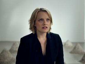 This image released by Magnolia Pictures shows Elisabeth Moss in a scene from "The Square."  (Magnolia Pictures via AP)