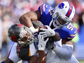 Buffalo Bills middle linebacker Preston Brown (52) tackles Tampa Bay Buccaneers' Doug Martin (22) during the first half of an NFL football game Sunday, Oct. 22, 2017, in Orchard Park, N.Y. (AP Photo/Rich Barnes)