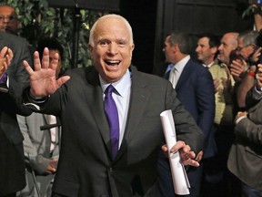 FILE - In this Nov. 8, 2016, file photo, Sen. John McCain, R-Ariz. waves to supporters as he arrives for his victory party prior to officially announcing his victory over Democrat Ann Kirkpatrick in Phoenix. McCain is this year's recipient of the National Constitution Center's Liberty Medal. The six-term Republican senator from Arizona will receive the award Monday, Oct. 16, 2017, at the Philadelphia museum for his "lifetime of sacrifice and service" to the country. (AP Photo/Ross D. Franklin, File)