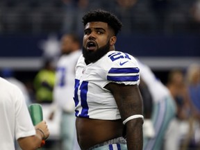 In this Oct. 1, 2017, photo, Dallas Cowboys' Ezekiel Elliott stands on the field during warmups before an NFL football game against the Los Angeles Rams in Arlington, Texas. Attorneys for Elliott are set for an emergency hearing in federal court in New York as they try again to stop the running back's six-game suspension over domestic violence allegations, a person with direct knowledge of the situation told The Associated Press on Monday night, Oct. 16. (AP Photo/Ron Jenkins)