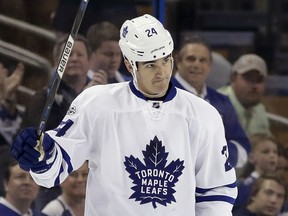 FILE - In this March 16, 2017, file photo, Toronto Maple Leafs center Brian Boyle (24) waves to the crowd as the Tampa Bay Lighting play a video tribute to Boyle during the first period of an NHL hockey game in Tampa, Fla. Boyle is joining a long list of NHL players who got back on the ice after beating cancer or while fighting it. (AP Photo/Chris O'Meara, File)
