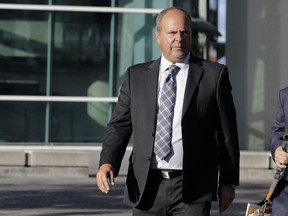 FILE - In this Feb. 1, 2017, file photo, sports agent Bartolo Hernandez leaves federal court in Miami. Hernandez and baseball trainer Julio Estrada are seeking lenient prison sentences after their convictions in Miami of smuggling Cuban players to the U.S. Sentencing is set for Nov. 2. (AP Photo/Lynne Sladky, File)