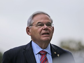 In this Oct. 23, 2017, photo, U.S. Sen. Bob Menendez arrives to court for his federal corruption trial in Newark, N.J. The judge in the bribery trial of Menendez and a wealthy friend is facing a decision on a motion for a mistrial. Attorneys for both defendants filed papers with the court Sunday, Oct. 29. (AP Photo/Seth Wenig)