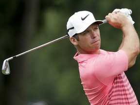 FILE- In this Aug. 11, 2017, file photo, Paul Casey of England, watches his tee shot on the eighth hole during the second round of the PGA Championship golf tournament at the Quail Hollow Club in Charlotte, N.C. Back among the top players in golf, Casey is rejoining the European Tour so he can get back to the Ryder Cup. (AP Photo/Chuck Burton, File)