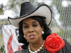 FILE- In this Wednesday, Oct. 18, 2017, file photo, Rep. Frederica Wilson, D-Fla., talks to reporters in Miami Gardens, Fla. Wilson is asking White House Chief of Staff John Kelly to apologize for making false claims about her while defending President Donald Trump's handling of condolences to a military family. Wilson on Sunday, Oct. 22, called Kelly a "puppet of the president" and accused him of character assassination. (AP Photo/Alan Diaz, File)