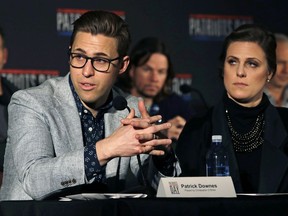 FILE- In this Dec. 15, 2016, photo, Boston Marathon bombing survivors Patrick Downes, left, and his wife Jessica Kensky address reporters in Boston, during a press availability for "Patriots Day," a movie based on the bombing. Downes and Kensky are awarding a scholarship to a college sophomore who lost a leg to cancer as a child. Jack Manning, of Norfolk, Mass., is the inaugural winner of the "Boston College Strong" scholarship being presented Monday, Oct. 23, 2017. (AP Photo/Charles Krupa, File)