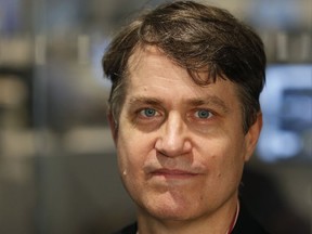 In this Thursday, Sept. 14, 2017, photo, Michael Hudson poses for a photograph, at The Associated Press headquarters in New York. Hudson, who shared the 2017 Pulitzer Prize for explanatory reporting for his work on the Panama Papers project that explored offshore financial secrecy, has been named global investigations editor for The AP. Hudson will be based at AP's headquarters in New York City and report to Managing Editor Brian Carovillano. (AP Photo/Kathy Willens)