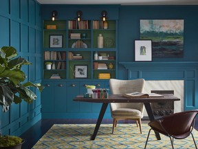 This undated photo provided by Sherwin-Williams shows their color Oceanside SW 6496 on the walls of this office, which the company announced today as their 2018 color of the year. The company's director of color marketing, Sue Wadden, said in a statement Tuesday, Oct. 3, 2017, the hue evokes a wanderlust that is both opulent and mysterious. She called Oceanside a widely embraced counterpart in interiors to a range of hues, from neon pink to desert taupe. Oceanside has been used in the design styles of mid-century modern, Mediterranean and ultra-contemporary.(Sherwin-Williams via AP)