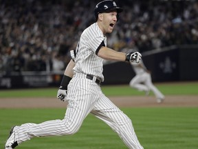New York Yankees' Todd Frazier reacts after hitting a home run during the third inning of Game 3 of baseball's American League Championship Series against the Houston Astros Monday, Oct. 16, 2017, in New York. (AP Photo/David J. Phillip)