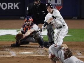 New York Yankees' Todd Frazier hits a three-run home run off Houston Astros starting pitcher Charlie Morton during the second inning of Game 3 of baseball's American League Championship Series Monday, Oct. 16, 2017, in New York. (AP Photo/Frank Franklin II)