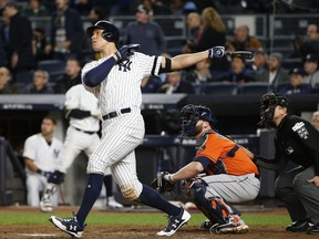 New York Yankees' Aaron Judge hits a home run during the seventh inning of Game 4 of baseball's American League Championship Series against the Houston Astros Tuesday, Oct. 17, 2017, in New York.