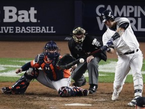 New York Yankees' Gary Sanchez hits a home run during the seventh inning of Game 5 of baseball's American League Championship Series against the Houston Astros Wednesday, Oct. 18, 2017, in New York. (AP Photo/Frank Franklin II)