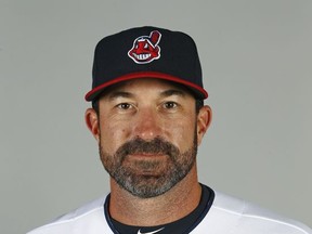 FILE - This Feb. 24, 2017 file photo shows Cleveland Indians pitching coach Mickey Callaway posing for a picture on photo day at the team's baseball spring training facility in Goodyear, Ariz. It appears the New York Mets have settled on their choice for a manager. Several media outlets are reporting the team has offered the job to Callaway. The New York Post was the first to report the Mets were in talks with Callaway, saying a deal is being finalized. When contacted Sunday, Oct. 22, 2017 multiple Mets officials declined to comment. (AP Photo/Ross D. Franklin)