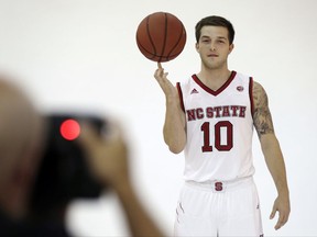 FILE - In this Sept. 26, 2017, file photo, North Carolina State's Braxton Beverly poses for a photograph during the school's NCAA college basketball media day in Raleigh, N.C. The NCAA has denied an appeal from the school seeking for the freshman to be eligible to play this year after taking summer classes at Ohio State before a late coaching change prompted him to get his release and come to N.C State. (AP Photo/Gerry Broome, File)