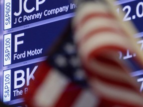 The Ford Motor Co. stock symbol appears on a board where it trades on the floor of the New York Stock Exchange, Thursday, Oct. 26, 2017. Pickup trucks helped Ford Motor Co. to a strong finish in the third quarter despite lower global sales. (AP Photo/Richard Drew)