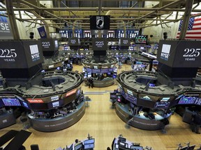 Traders work on the floor of the New York Stock Exchange, Wednesday, Oct. 18, 2017. What if the stock market plunged 20 percent tomorrow? The question may seem absurd when the market is in the midst of one of its calmest runs in history and at record highs. But it's what investors had to deal with 30 years ago, when "Black Monday" blasted stocks on Oct. 19, 1987. (AP Photo/Richard Drew)