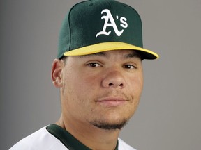 FILE - This 2014 file photo shows Oakland Athletics catcher Bruce Maxwell. Maxwell was arrested Saturday, Oct. 28, 2017, in Scottsdale, Ariz., after a female food delivery person alleged he pointed a gun at her. (AP Photo/ Gregory Bull, File)