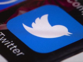 FILE- This April 26, 2017, file photo shows the Twitter app on a mobile phone in Philadelphia. Twitter has handed over to Senate investigators the profile names, or "handles," of 201 accounts linked to Russian attempts at influencing the 2016 presidential election. The company has stepped up its efforts to cooperate with investigators after it was criticized for not taking congressional probes seriously enough. The handover occurred this week, according to a person familiar with the matter who was not authorized to speak publicly about it.(AP Photo/Matt Rourke, File)