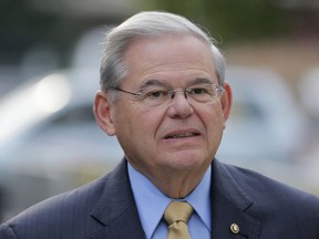 FILE - In this Sept. 6, 2017, file photo, Sen. Bob Menendez arrives to court for his federal corruption trial in Newark, N.J. Karissa Willhite, former staffer for Menendez has given testimony Wednesday, Oct. 18, 2017, at his bribery trial that differs from the prosecution's version of events.   (AP Photo/Seth Wenig, File)