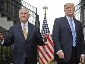 FILE - In this Aug. 11, 2017, file photo, Secretary of State Rex Tillerson, left, speaks following a meeting with President Donald Trump at Trump National Golf Club in Bedminster, N.J. The strained relationship between President Donald Trump and Secretary of State Rex Tillerson came under renewed focus Sunday, Oct. 15, during an interview with Jake Tapper on CNN, as Tillerson insisted that Trump has not undermined him even as he again refused to deny calling the president "a moron."(AP Photo/Pablo Martinez Monsivais, File)