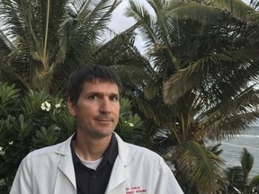 In this Sept. 29, 2017 photo, Dr. Graham Chelius stands outside his home on the Hawaiian island of Kauai. Chelius, a family medicine doctor, is a plaintiff in a lawsuit being filed by the American Civil Liberties Union challenging U.S. Food and Drug Administration restrictions that limit many women's access to the so-called abortion pill. Chelius would like to be able to write prescriptions so women could obtain the pill at pharmacies, which is currently banned by the FDA. (Courtesy of Chelius family via AP)