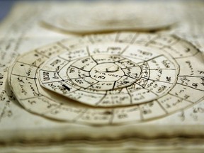 A manuscript that includes astronomical calculators is displayed at the YIVO Institute for Jewish Research in New York, Tuesday, Oct. 24, 2017. This document along with more than 170,000 other pages are part of a recently discovered trove of Jewish materials from Lithuania thought to have been destroyed during the Holocaust. (AP Photo/Seth Wenig)