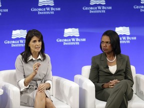 U.S. Ambassador to the United Nations Nikki Haley, left, and former U.S. Secretary of State Condoleeza Rice participate in a panel discussion at a forum sponsored by the George W. Bush Institute in New York, Thursday, Oct. 19, 2017. (AP Photo/Seth Wenig)