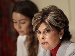 Mimi Haleyi, left, appears with her attorney Gloria Allred at a news conference in New York, Tuesday, Oct. 24, 2017. Haleyi claims producer Harvey Weinstein forcibly performed oral sex on her in 2006 when she was in her 20s. Representatives for Weinstein did not immediately comment Tuesday. Weinstein has previously denied any non-consensual sexual encounters. (AP Photo/Seth Wenig)